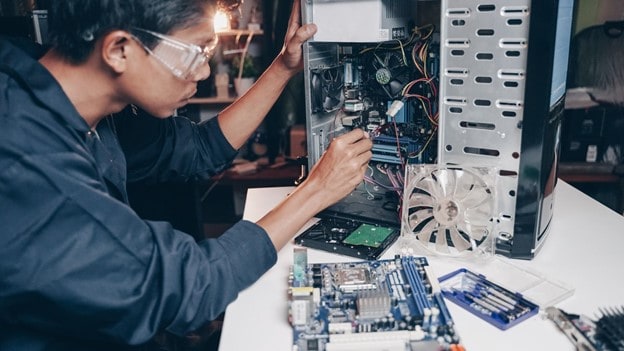 Person fixing a computer